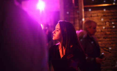 Woman at a summer event, enjoying the atmosphere.